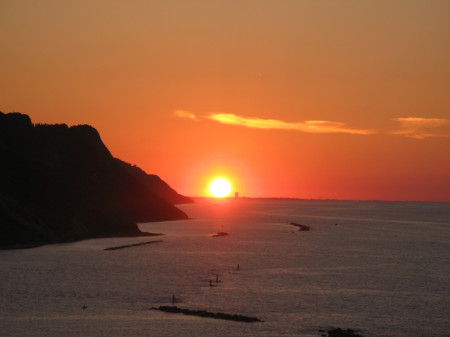 Sole su Rimini al tramonto visto da Baia Flaminia